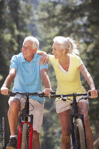 Photo: Senior couple on country bike ride Senior couple on country bike ride