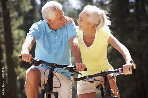 Photo: Senior couple on country bike ride Senior couple on country bike ride
