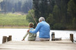 Photo: Senior man fishing with grandson Senior man fishing with grandson