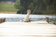 Young boy fishing on a jetty Young boy fishing on a jetty