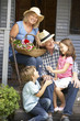 Senior couple on veranda with grandchildren