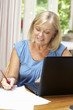 Senior Woman Working In Home Office
