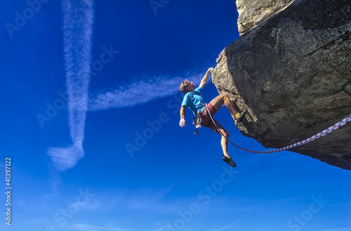 Photo: Middle aged male rock climber. Middle aged male rock climber.