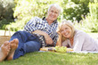 Photo: Senior couple with picnic in park Senior couple with picnic in park