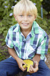Young boy gardening