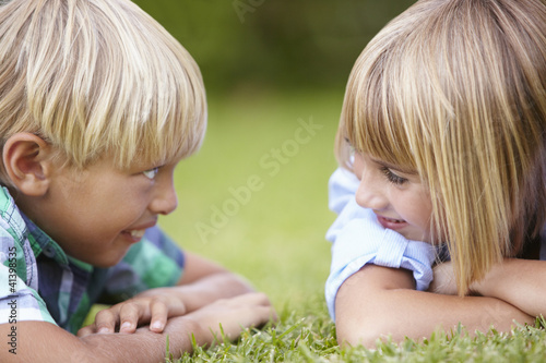 Photo: Young boy and girl outdoors Young boy and girl outdoors