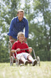 Foto: Father and son playing with go-kart Father and son playing with go-kart