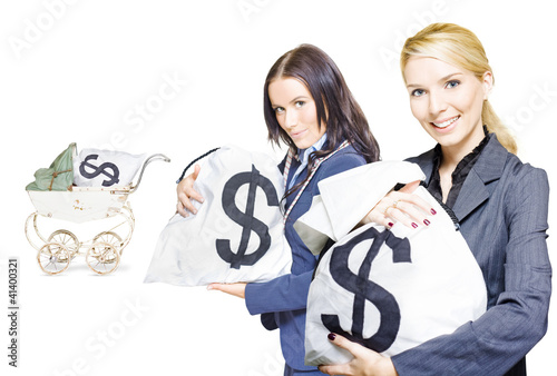 Photo: Pretty young business women holding sacks of money Pretty young business women holding sacks of money