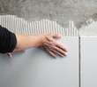 construction mason man hands on tiles work construction mason man hands on tiles work