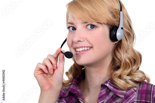 Photo: Woman speaking into a headset Woman speaking into a headset