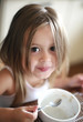 Little girl eating breakfast