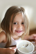 Cute girl having breakfast