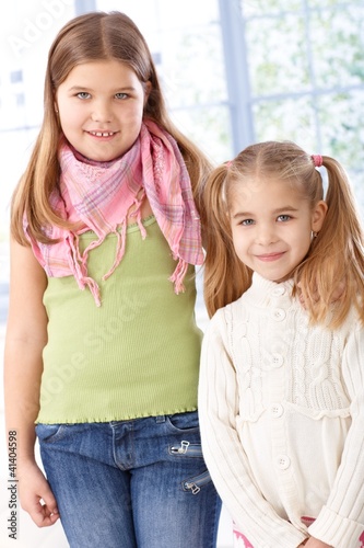 Foto: Portrait of little sisters smiling Portrait of little sisters smiling