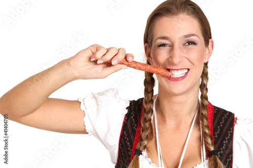 Photo: Frau im Dirndl mit Wurst Frau im Dirndl mit Wurst