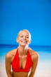 Happy young woman on the beach