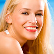 Happy young woman on the beach