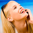Young woman with cellphone on beach