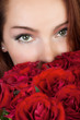 woman with a bouquet of red roses
