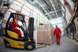 Photo: two workers work in storehouse two workers work in storehouse