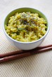 Yellow rice with saffron and zucchini in a bowl with chopsticks Yellow rice with saffron and zucchini in a bowl with chopsticks