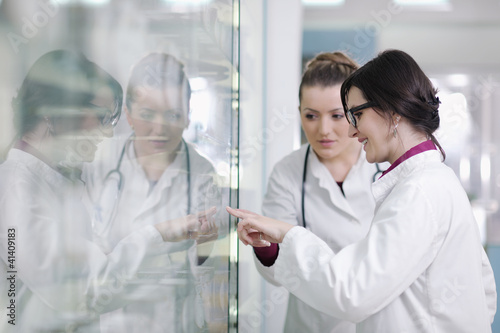 Photo: team of pharmacist chemist woman in pharmacy drugstore team of pharmacist chemist woman in pharmacy drugstore