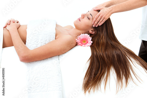 Photo: Young woman having head massage. Young woman having head massage.