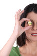 Woman covering her eye with easter egg