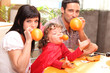 Family inflating balloons for Halloween