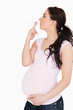 Young pregnant woman smoking