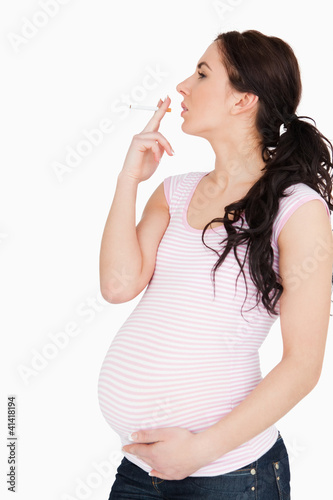 Photo: Young pregnant woman smoking Young pregnant woman smoking