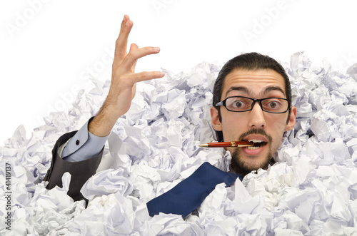 Photo: Man with lots of waste paper Man with lots of waste paper