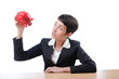 Woman and piggybank on white