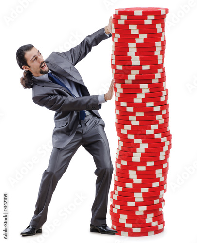 Foto: Businessman and casino chips on white Businessman and casino chips on white