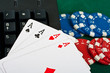 Fragment of black keyboard with gamble chips and cards. Fragment of black keyboard with gamble chips and cards.