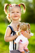 little girl with doll