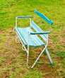 The Old bench on green grass background