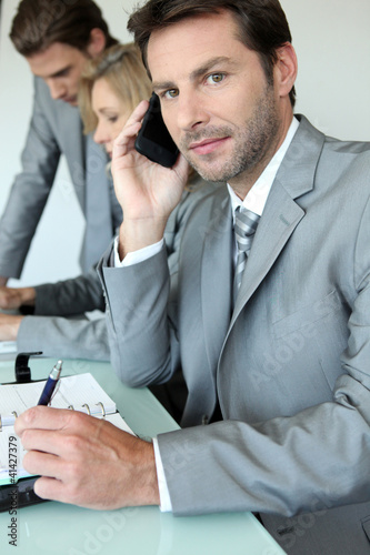Photo: Executive on cellphone Executive on cellphone