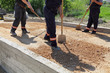 Road construction, workers with shovel