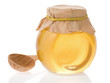 jar of honey and wood spoon isolated on white jar of honey and wood spoon isolated on white