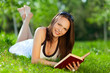 Beautiful Young woman reading a book in park Beautiful Young woman reading a book in park