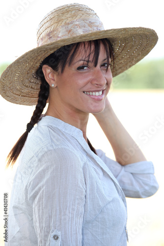 Photo: Brunette woman with hat Brunette woman with hat