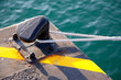 Bollard in port with rope looped around