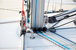 Detail of sailboat mast bottom with ropes