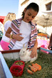 Woman petting a rabbit