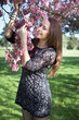 Beautiful young woman in spring garden