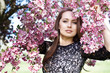 Beautiful young woman in spring garden