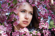 Beautiful young woman in spring garden
