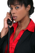 canvas print picture - Businesswoman using a landline