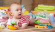 baby girl with  baby's things