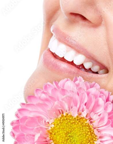 Photo: Beautiful woman face with flower. Beautiful woman face with flower.